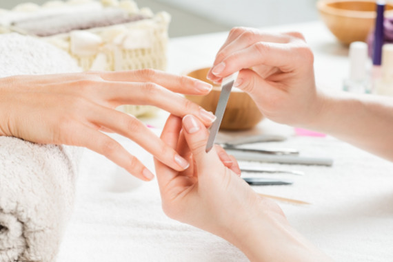 Woman having manicure